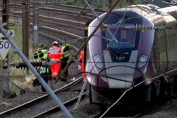 Train collision north of London kills 1, injures dozens