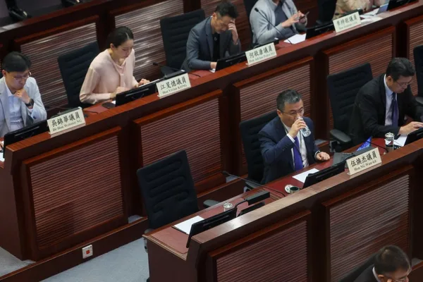 Hong Kong lawmaker resigns amid legal issues; seat replacement debated