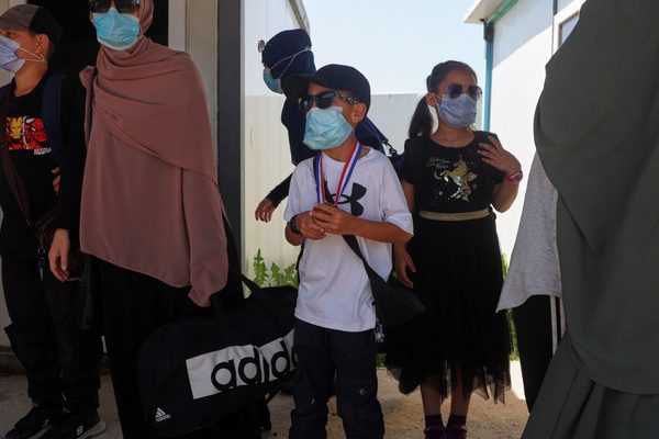 Australia prepares for arrests as 13 Isis-linked individuals return from Syria