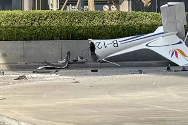 Pilot dies in plane crash into Beijing's Citic Tower; 13 injured
