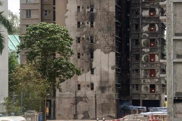 Hong Kong estate administrator to meet residents after legal threats over fire