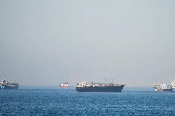 Cargo ship Ever Lovely hit by projectile in Strait of Hormuz; UN pauses escorts