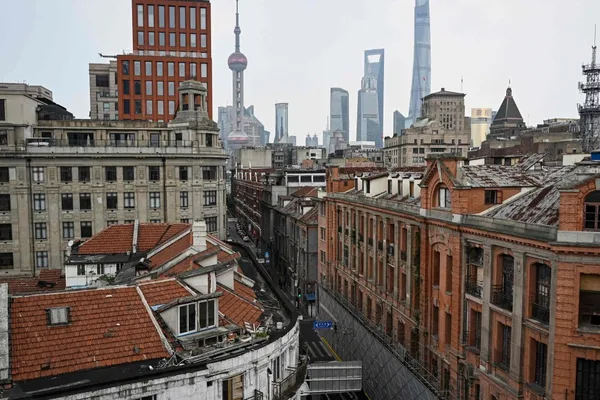 Shanghai urged to become finance hub, rivaling Hong Kong for outbound investment